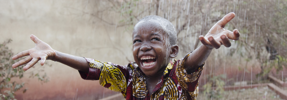 Sweet little African boy under the rain in Mali (Africa ...